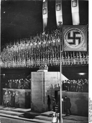 ... Mussolini, Ciano, Göring, and Hitler standing beneath the grandstand