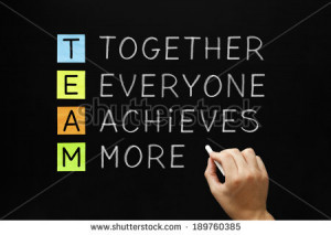Hand writing TEAM - Together Everyone Achieves More with white chalk ...