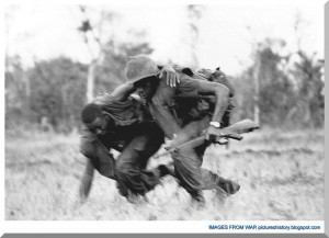 ... to cover despite North Vietnamese fire during battle on May 15, 1967