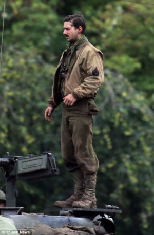 ... the mud and battered combat gear, Brad and Shia looked suave on set