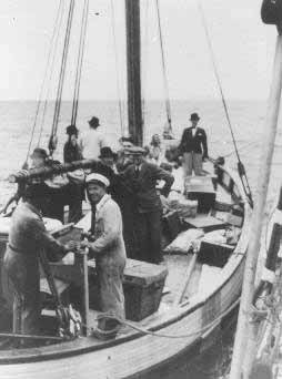 Danish fishermen (foreground) ferry Jews across a narrow sound to ...