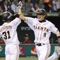 Plenty to celebrate: The Giants' Yoshiyuki Kamei (right) and teammate ...