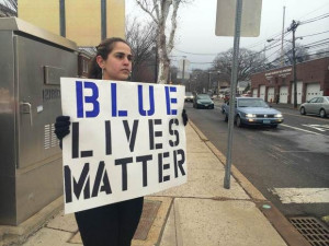 ... one-woman demonstration Monday outside the Metuchen police station
