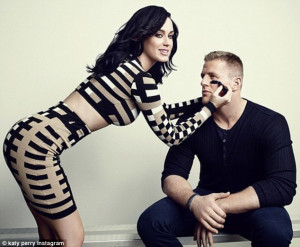 ... during Super Bowl as she puts arm around JJ Watt for ESPN magazine