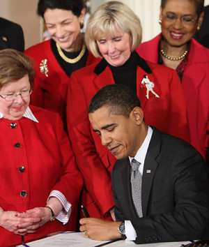 President Barack Obama signs the Lilly Ledbetter Bill.