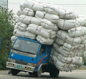 Cushioned landing: This truck is clearly battling with its load as it ...
