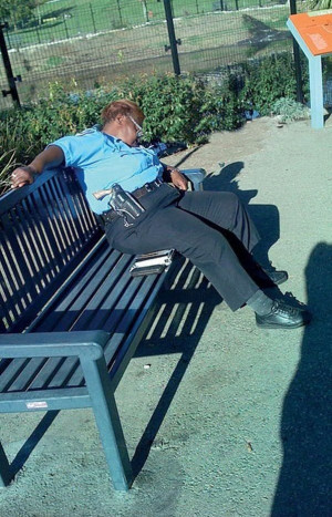 Female Police Officer with Gun Sleeping on the Job
