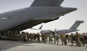 Going home: U.S. soldiers board a military plane at a base in Bagram ...