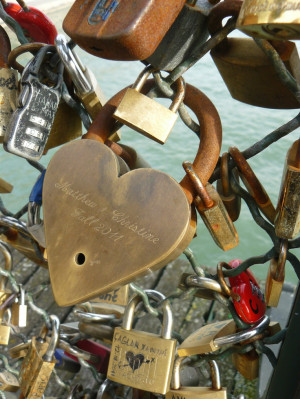 Lock Bridge in Paris. Couples bring a lock and key, make a wish for ...