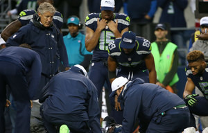 Seahawks wide receiver Chris Matthews is tended to after a shoulder ...