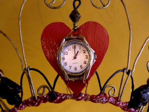 silver-tone watch face is affixed to the middle, and handmade ...