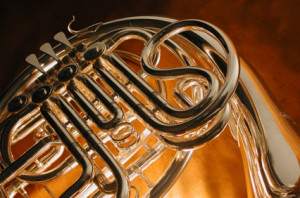 Close-up view of a French horn, showing its gleaming surfaces and ...