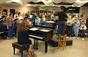 Christmas Choir Rehearsal Choir begins rehearsing