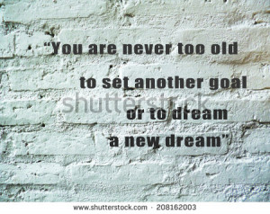 ... motivating quote on pastel block brick wall - stock photo