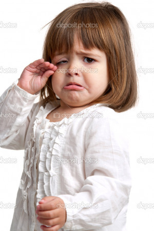 Unhappy little girl crying - Stock Image