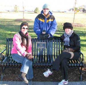 Shown on the Thomas memorial bench are his wife Pam Thomas (right ...