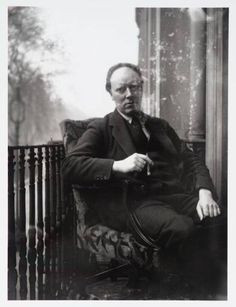 Clive Bell smoking a cigar on the balcony of 46 Gordon Square