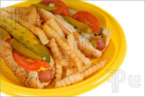 Photo of Chicago style hot dogs with french fries on yellow plate I