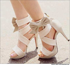 These ivory high heels sandals with multiple wide straps are not only ...