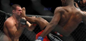 Jon Jones, right, kicks Mauricio Rua during their...