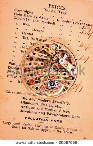 ... pocket watch movement on old gold merchant's quote. - stock photo