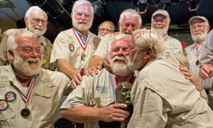 Greg Fawcett, center front, gets a congratulatory smooch from Matt ...