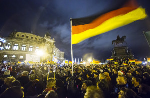 Participants hold German national flags during a demonstration ...