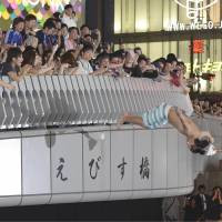 Japanese Soccer Fan Dives Into The Dotonbori River In Osaka Japan