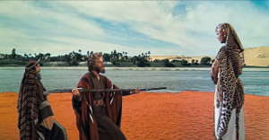 ... Charlton Heston as Moses , appearing beside Yul Brynner ( Rameses