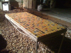 Outdoor coffee table using bottle caps – magic hat sayings