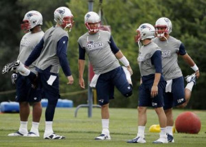 Tom Brady (center) and the Patriots are in the final stretch of the ...