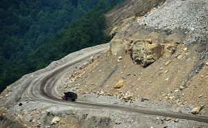 truck loaded with coal makes its way from a coal mine on top of ...
