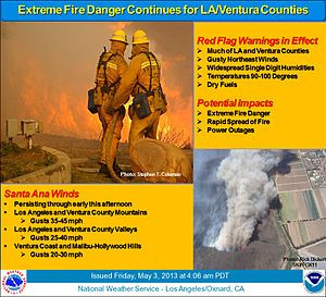 Fire crews battle California wildfire fanned by strong Santa Ana winds