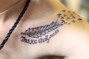 feather and birds on collar bone