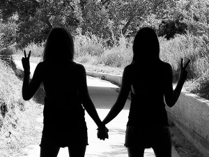 of best friends holding each other s hand with the free hand up in ...