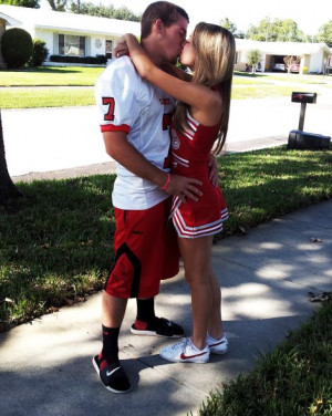 cheerleader couple kiss football cheerleading