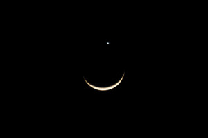 Planet Venus on top of crescent moon