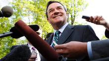 Minister of Finance Jim Flaherty speaks to the media before attending ...