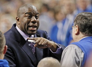 Basketball legend Magic Johnson speaks with former Kentucky coach Joe ...