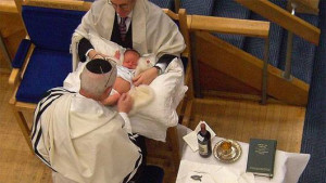 SNIP: A baby about to recieve a circumcision during a brit milah ...