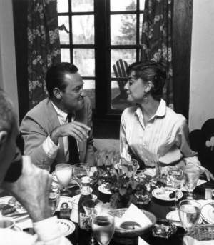 American actor William Holden and Hepburn smile at each other during a ...