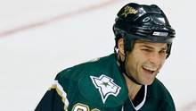Dallas Stars center Eric Lindros is all smiles after scoring a third ...