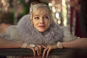 Carey Mulligan as Daisy Buchanan wears a Prada fur and Tiffany jewels ...