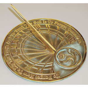 This solid brass sundial featuring a quote from Mahatma Gandhi that ...