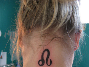 back-neck-black-ink-leo-zodiac-sign-tattoo.jpg