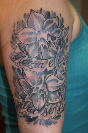 amazon lilies and portuguese script tattoo