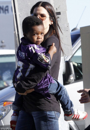 Proud mama: Sandra dressed her son, Louis, in a Michael Oher jersey as ...