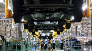 Mitsubishi Motors Corp. Mirage vehicles move along the production line ...