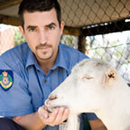 Purity Quote - Photo of RSPCA inspector feeding a goat