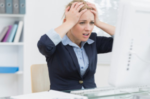 Business Woman Using Computer Frustrated business woman